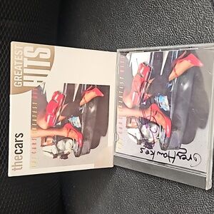 The car's greatest hits CD 2 handsign. Autographs, bye Ellio Easton and greg haw